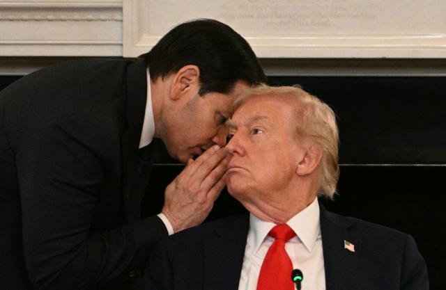 AFP PICTURES OF THE YEAR 2025

US Secretary of State Marco Rubio whispers in the ear of President Donald Trump during a roundtable about Antifa in the State Dining Room of the White House in Washington, DC, on October 8, 2025. (Photo by Jim WATSON / AFP) / AFP PICTURES OF THE YEAR 2025
