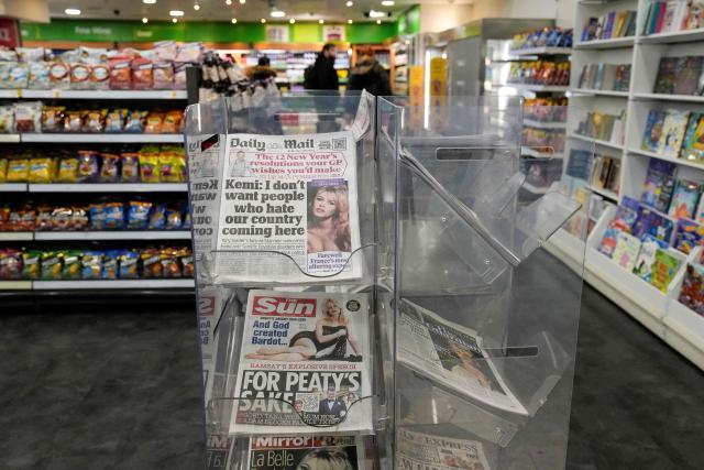 A newsstand is pictured in a shop in London on December 29, 2025, showing British newspapers covered with images of late French film actress Brigitte Bardot. Bardot, a symbol of sexual liberation in the 1950s and 1960s who reinvented herself as an animal rights defender and embraced far-right views, died on December 28 at the age of 91, her foundation said. (Photo by CARLOS JASSO / AFP)