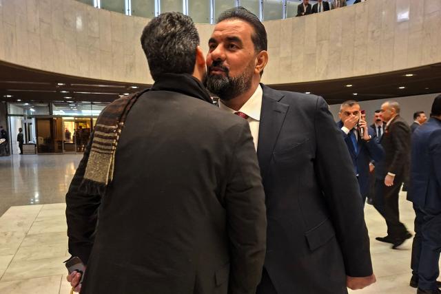 Hebat al?Halbousi, a candidate for the position of speaker of Iraq’s parliament, arrives at the parliament in Baghdad as newly elected lawmakers are due to hold their first session on December 29, 2025. (Photo by AHMAD AL-RUBAYE / AFP)