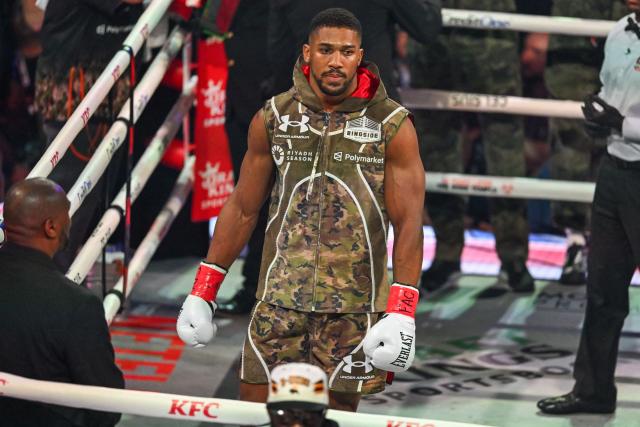 (FILES) British boxer Anthony Joshua arrives for his non-title heavyweight bout against US boxer and influencer Jake Paul at the Kaseya Center in Miami, Florida on December 19, 2025. Former world heavyweight champion Anthony Joshua was injured in a fatal highway accident that killed two people on December 29, 2025, Nigerian media reported.
Punch newspaper said the crash occurred on the Lagos-Ibadan expressway when the car he was riding in collided with a truck. (Photo by Giorgio VIERA / AFP)