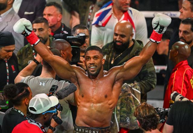 (FILES) British boxer Anthony Joshua celebrates after defeating US boxer and influencer Jake Paul (off frame) in a non-title heavyweight bout at the Kaseya Center in Miami, Florida, on December 19, 2025. Former world heavyweight champion Anthony Joshua was injured in a fatal highway accident that killed two people on December 29, 2025, Nigerian media reported.
Punch newspaper said the crash occurred on the Lagos-Ibadan expressway when the car he was riding in collided with a truck. (Photo by Giorgio VIERA / AFP)