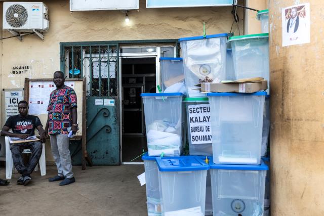 Officials of the General Directorate of Elections (DGE) stand next to ballot boxes full of electoral materials at Dixinn’s city hall in Conakry, on December 29, 2025, the day after voting during Guinea’s presidential election. Initial results in Guinea's presidential election were due on December 29, 2025, officials said, a day after the vote in which junta chief Mamady Doumbouya is seeking to legitimise his rule.
The main opposition leaders were barred from standing and had urged a boycott of the ballot, which comes four years after Doumbouya led a coup to topple Guinea's first freely elected president. (Photo by PATRICK MEINHARDT / AFP)