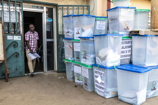 An official of the General Directorate of Elections (DGE) walks past ballot boxes full of electoral materials at Dixinn’s city hall in Conakry, on December 29, 2025, the day after voting during Guinea’s presidential election. Initial results in Guinea's presidential election were due on December 29, 2025, officials said, a day after the vote in which junta chief Mamady Doumbouya is seeking to legitimise his rule.
The main opposition leaders were barred from standing and had urged a boycott of the ballot, which comes four years after Doumbouya led a coup to topple Guinea's first freely elected president. (Photo by PATRICK MEINHARDT / AFP)