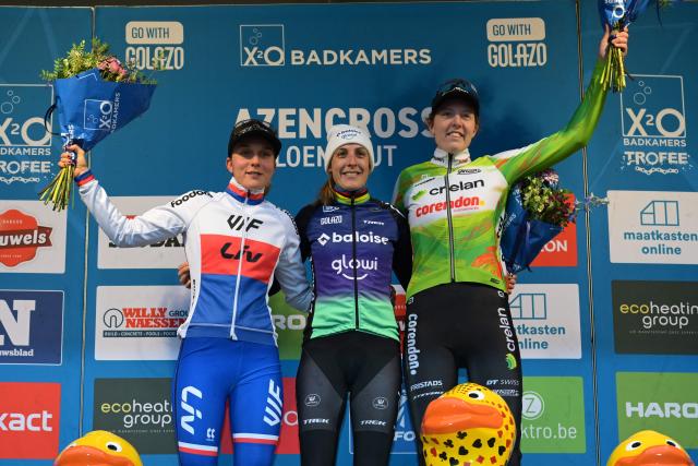 Czech Kristyna Zemanova (L), Dutch Lucinda Brand (C) and Dutch Manon Bakker celebrate on the podium after the women's elite race of the Azencross, the fifth stage in the DVV Trofee (out of eight) in Loenhout, on December 29, 2025. (Photo by DAVID PINTENS / Belga / AFP) / Belgium OUT
