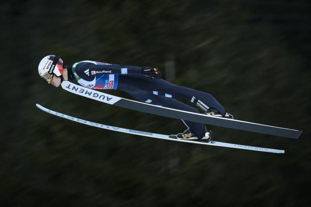Germany's Philipp Raimund jumps during the trial round of the Men's Individual Large Hill HS137 event of the FIS Ski Jumping World Cup, the first leg of the Four Hills Tournament, in Oberstdorf, southern Germany on December 29, 2025. (Photo by Philipp Guelland / AFP)