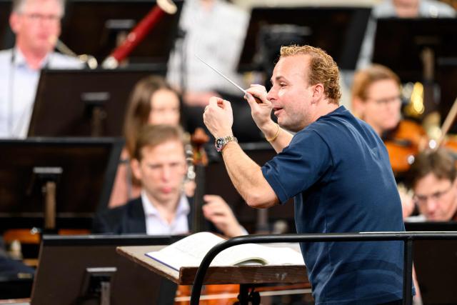 Canadian conductor Yannick Nézet-Séguin conducts the Vienna Philharmonic Orchestra during a rehearsal for the 2026 New Year's Concert, on December 29, 2025 in Vienna, Austria. (Photo by MAX SLOVENCIK / APA / AFP) / Austria OUT