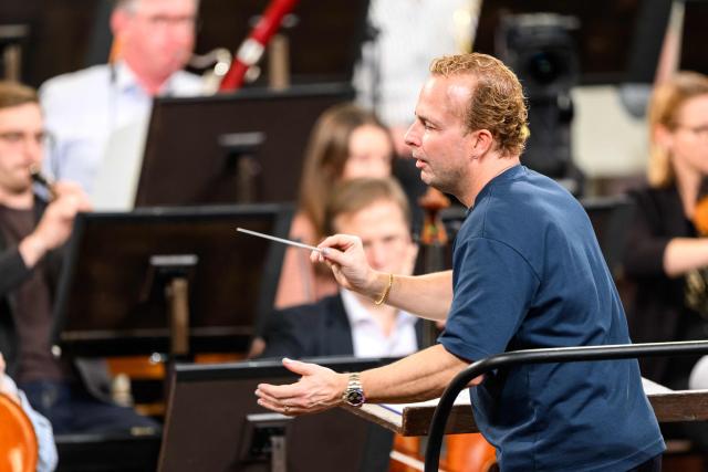 Canadian conductor Yannick Nézet-Séguin conducts the Vienna Philharmonic Orchestra during a rehearsal for the 2026 New Year's Concert, on December 29, 2025 in Vienna, Austria. (Photo by MAX SLOVENCIK / APA / AFP) / Austria OUT