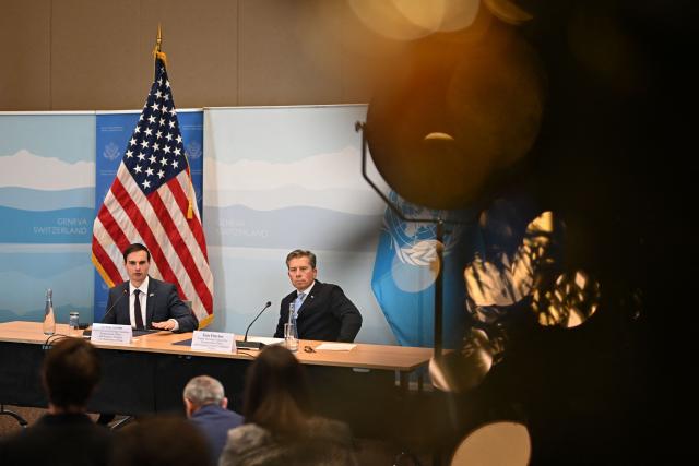 US Under Secretary of State for Foreign Assistance, Humanitarian Affairs and Religious Freedom Jeremy Lewin (L) and United Nations Under-Secretary-General for Humanitarian Affairs Tom Fletcher attend the signing ceremony of a $2 billion pledge of United States for United Nations humanitarian aid in 2026, at the US Mission in Geneva, on December 29, 2025. According to UN data, the United States remains the top humanitarian aid donor in the world, but that amount fell significantly in 2025 to $2.7 billion, down from around $11 billion in 2023 and 2024 and from over $14 billion in 2022. (Photo by Fabrice COFFRINI / AFP)