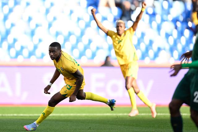 South Africa's defender #19 Nkosinathi Sibisi (L) celebrates scoring the team's first goal during the Africa Cup of Nations (CAN) Group B football match between Zimbabwe and South Africa at Marrakesh Stadium in Marrakesh on December 29, 2025. (Photo by Khaled DESOUKI / AFP)