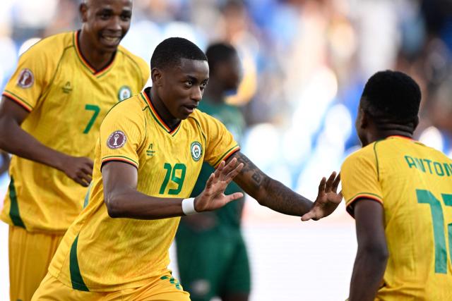 South Africa's defender #19 Nkosinathi Sibisi (L) celebrates scoring the team's first goal during the Africa Cup of Nations (CAN) Group B football match between Zimbabwe and South Africa at Marrakesh Stadium in Marrakesh on December 29, 2025. (Photo by Khaled DESOUKI / AFP)