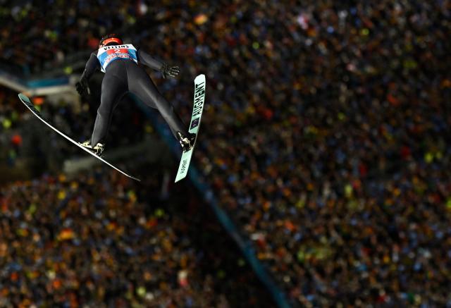 Germany's Philipp Raimund competes during the first round of the Men's Individual Large Hill HS137 event of the FIS Ski Jumping World Cup, the first leg of the Four Hills Tournament, in Oberstdorf, southern Germany on December 29, 2025. (Photo by PHILIPP GUELLAND / AFP)
