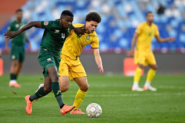 South Africa's midfielder #04 Teboho Mokoena comes under pressure from Zimbabwe's midfielder #08 Jonah Fabisch during the Africa Cup of Nations (CAN) Group B football match between Zimbabwe and South Africa at Marrakesh Stadium in Marrakesh on December 29, 2025. (Photo by Khaled DESOUKI / AFP)