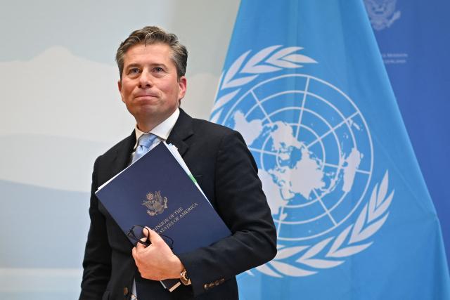 United Nations Under-Secretary-General for Humanitarian Affairs Tom Fletcher gestures after the signing ceremony of a $2 billion pledge of United States for United Nations humanitarian aid in 2026, at the US Mission in Geneva, on December 29, 2025. According to UN data, the United States remains the top humanitarian aid donor in the world, but that amount fell significantly in 2025 to $2.7 billion, down from around $11 billion in 2023 and 2024 and from over $14 billion in 2022. (Photo by Fabrice COFFRINI / AFP)