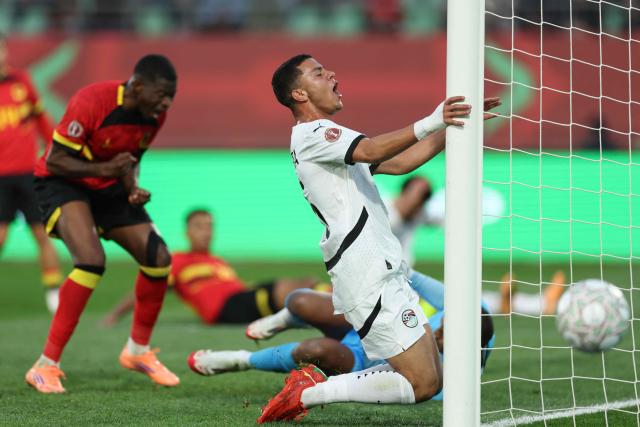 Egypt's midfielder #15 Mohamed Shehata (C) reacts after missing a goal during the Africa Cup of Nations (CAN) Group B football match between Angola and Egypt at Adrar Stadium in Agadir on December 29, 2025. (Photo by FRANCK FIFE / AFP)