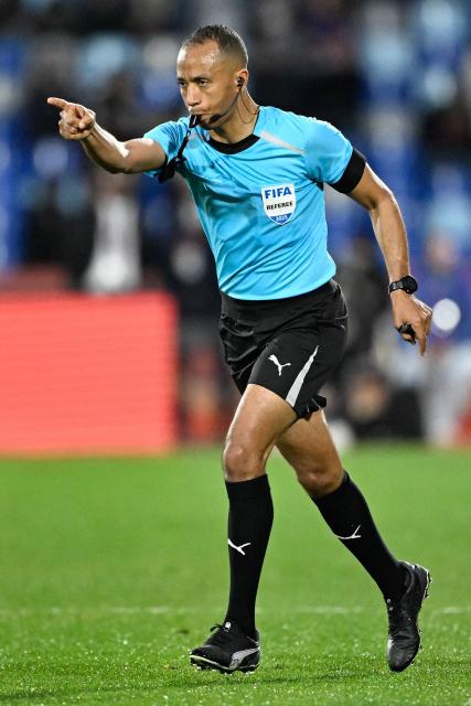 Moroccan referee Mustapha Kechchaf awards a penalty to South Africa during the Africa Cup of Nations (CAN) Group B football match between Zimbabwe and South Africa at Marrakesh Stadium in Marrakesh on December 29, 2025. (Photo by Khaled DESOUKI / AFP)