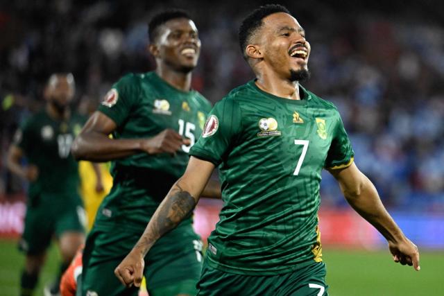 South Africa's midfielder #07 Oswin Appollis celebrates scoring the team's third goal from a penalty during the Africa Cup of Nations (CAN) Group B football match between Zimbabwe and South Africa at Marrakesh Stadium in Marrakesh on December 29, 2025. (Photo by Khaled DESOUKI / AFP)