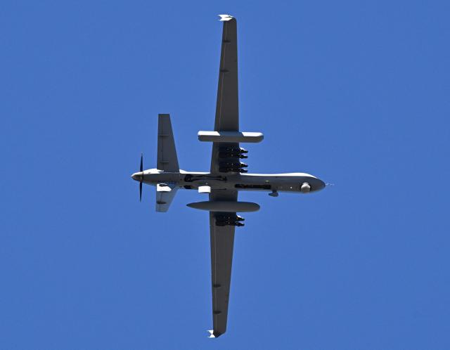 A US military MQ-9 Reaper drone approaches for landing at Rafael Hernandez Airport in Aguadilla, Puerto Rico, on December 29, 2025. The United States has deployed a major military force in the Caribbean and has recently intercepted oil tankers as part of a naval blockade against Venezuelan vessels it considers to be under sanctions. Since September, US forces have launched dozens of air strikes on boats that Washington alleges, without showing evidence, were transporting drugs. More than 100 people have been killed. (Photo by Miguel J. Rodriguez Carrillo / AFP)