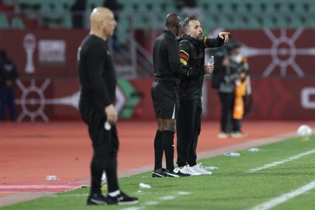 Angola's head coach Patrice Baumelle (C) gestures from the touchline during the Africa Cup of Nations (CAN) Group B football match between Angola and Egypt at Adrar Stadium in Agadir on December 29, 2025. (Photo by FRANCK FIFE / AFP)