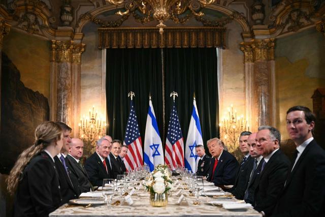 US President Donald Trump (center R) meets with Israeli Prime Minister Benjamin Netanyahu (center L) during a bilateral meeting at Trump’s Mar-a-Lago residence in Palm Beach, Florida, on December 29, 2025. Pictured alongside Trump are, L/R, Chairman of the Joint Chiefs of Staff Dan Caine, Defense Secretary Pete Hegseth, Deputy Chief of Staff Stephen Miller, White House Special Envoy Steve Witkoff, and Trump's son-in-law Jared Kushner. (Photo by Jim WATSON / AFP)