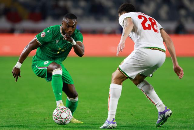 Comoros's defender #15 Benjaloud Youssouf (L) challenges Mali's defender #28 Nathan Gassama during the Africa Cup of Nations (CAN) Group A football match between Comoros and Mali at Mohammed V Stadium in Casablanca on December 29, 2025. (Photo by Abdel Majid BZIOUAT / AFP)