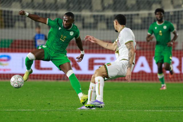 Comoros's defender #15 Benjaloud Youssouf and Mali's defender #28 Nathan Gassama compete for the ball during the Africa Cup of Nations (CAN) Group A football match between Comoros and Mali at Mohammed V Stadium in Casablanca on December 29, 2025. (Photo by Abdel Majid BZIOUAT / AFP)