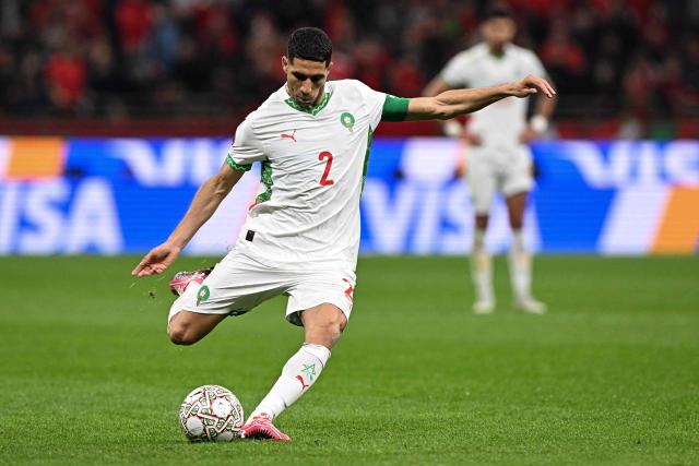 Morocco's defender #02 Achraf Hakimi shoots during the Africa Cup of Nations (CAN) group stage football match between Zambia and Morocco at Prince Moulay Abdellah Stadium in Rabat on December 29, 2025. (Photo by Gabriel BOUYS / AFP)