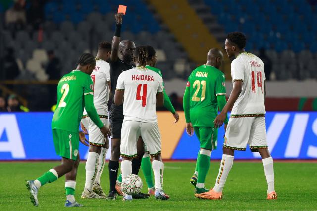 Chadian referee Alhadi Allaou Mahamat sends off Mali's midfielder #04 Amadou Haidara during the Africa Cup of Nations (CAN) Group A football match between Comoros and Mali at Mohammed V Stadium in Casablanca on December 29, 2025. (Photo by Abdel Majid BZIOUAT / AFP)