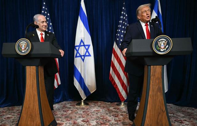 US President Donald Trump (R) and Israeli Prime Minister Benjamin Netanyahu speak to journalists during a joint press conference at Trumps Mar-a-Lago residence in Palm Beach, Florida, on December 29, 2025. US President Donald Trump hosted Israeli Prime Minister Benjamin Netanyahu in Florida on December 29 for crucial talks on moving to the next stage of the fragile Gaza truce plan.
The two leaders also discussed Iran, with Trump saying that if Tehran rebuilt its nuclear facilities the United States would "knock them down." (Photo by Jim WATSON / AFP)
