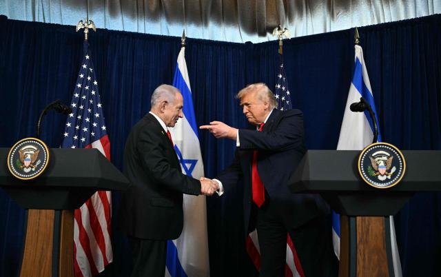 US President Donald Trump (R) and Israeli Prime Minister Benjamin Netanyahu arrive to speak to journalists during a joint press conference at Trumps Mar-a-Lago residence in Palm Beach, Florida, on December 29, 2025. US President Donald Trump hosted Israeli Prime Minister Benjamin Netanyahu in Florida on December 29 for crucial talks on moving to the next stage of the fragile Gaza truce plan.
The two leaders also discussed Iran, with Trump saying that if Tehran rebuilt its nuclear facilities the United States would "knock them down." (Photo by Jim WATSON / AFP)
