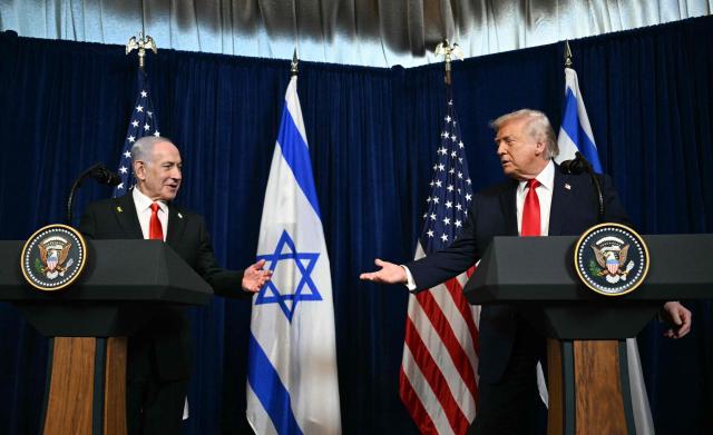 US President Donald Trump (R) and Israeli Prime Minister Benjamin Netanyahu speak to journalists during a joint press conference at Trumps Mar-a-Lago residence in Palm Beach, Florida, on December 29, 2025. US President Donald Trump hosted Israeli Prime Minister Benjamin Netanyahu in Florida on December 29 for crucial talks on moving to the next stage of the fragile Gaza truce plan.
The two leaders also discussed Iran, with Trump saying that if Tehran rebuilt its nuclear facilities the United States would "knock them down." (Photo by Jim WATSON / AFP)