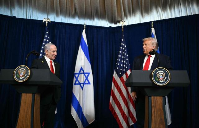 US President Donald Trump (R) and Israeli Prime Minister Benjamin Netanyahu speak to journalists during a joint press conference at Trumps Mar-a-Lago residence in Palm Beach, Florida, on December 29, 2025. US President Donald Trump hosted Israeli Prime Minister Benjamin Netanyahu in Florida on December 29 for crucial talks on moving to the next stage of the fragile Gaza truce plan.
The two leaders also discussed Iran, with Trump saying that if Tehran rebuilt its nuclear facilities the United States would "knock them down." (Photo by Jim WATSON / AFP)