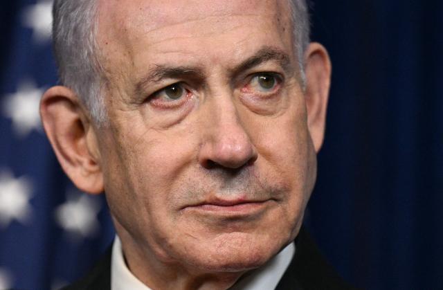 Israeli Prime Minister Benjamin Netanyahu looks on as US President Donald Trump (off frame) speaks during a joint press conference at Trumps Mar-a-Lago residence in Palm Beach, Florida, on December 29, 2025. US President Donald Trump hosted Israeli Prime Minister Benjamin Netanyahu in Florida on December 29 for crucial talks on moving to the next stage of the fragile Gaza truce plan.
The two leaders also discussed Iran, with Trump saying that if Tehran rebuilt its nuclear facilities the United States would "knock them down." (Photo by Jim WATSON / AFP)