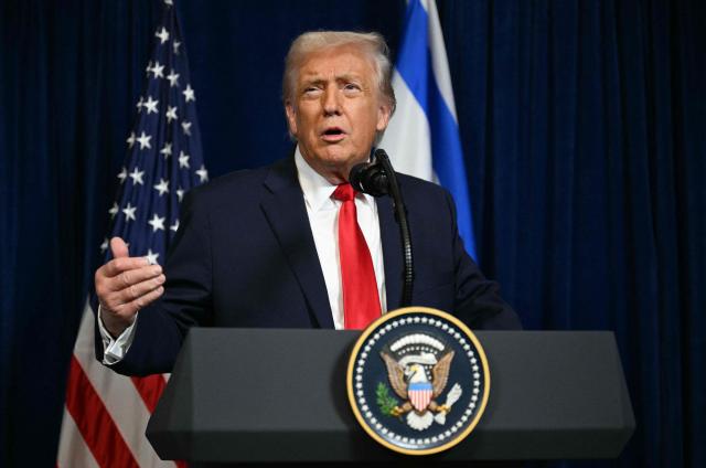 US President Donald Trump speaks during a joint press conference with Israeli Prime Minister Benjamin Netanyahu (off frame) at Trump’s Mar-a-Lago residence in Palm Beach, Florida, on December 29, 2025. US President Donald Trump hosted Israeli Prime Minister Benjamin Netanyahu in Florida on December 29 for crucial talks on moving to the next stage of the fragile Gaza truce plan.
The two leaders also discussed Iran, with Trump saying that if Tehran rebuilt its nuclear facilities the United States would "knock them down." (Photo by Jim WATSON / AFP)