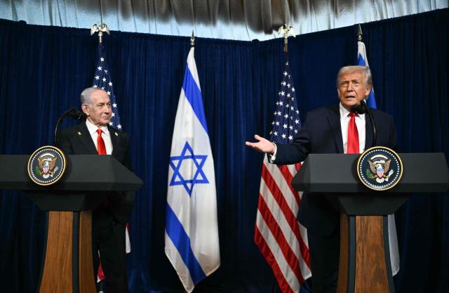 Israeli Prime Minister Benjamin Netanyahu (L) looks on as US President Donald Trump speaks to journalists during a joint press conference at Trumps Mar-a-Lago residence in Palm Beach, Florida, on December 29, 2025. US President Donald Trump hosted Israeli Prime Minister Benjamin Netanyahu in Florida on December 29 for crucial talks on moving to the next stage of the fragile Gaza truce plan.
The two leaders also discussed Iran, with Trump saying that if Tehran rebuilt its nuclear facilities the United States would "knock them down." (Photo by Jim WATSON / AFP)