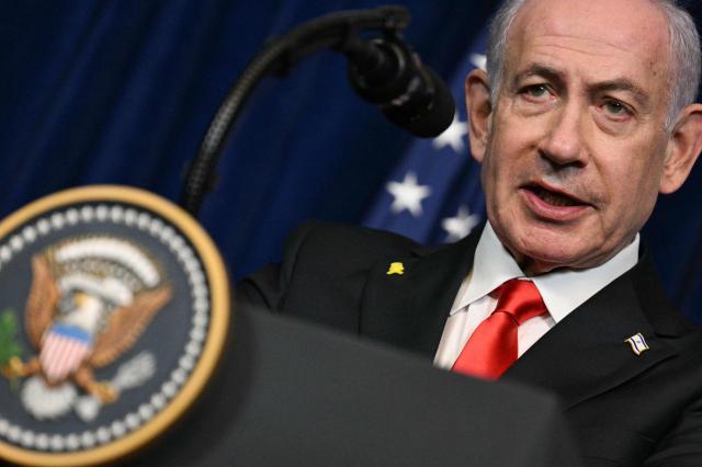 Israeli Prime Minister Benjamin Netanyahu speaks during a joint press conference with US President Donald Trump (off frame) at Trump’s Mar-a-Lago residence in Palm Beach, Florida, on December 29, 2025. US President Donald Trump hosted Israeli Prime Minister Benjamin Netanyahu in Florida on December 29 for crucial talks on moving to the next stage of the fragile Gaza truce plan.
The two leaders also discussed Iran, with Trump saying that if Tehran rebuilt its nuclear facilities the United States would "knock them down." (Photo by Jim WATSON / AFP)