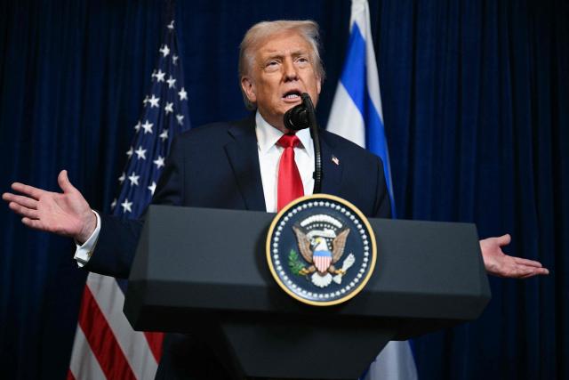 US President Donald Trump speaks during a joint press conference with Israeli Prime Minister Benjamin Netanyahu (off frame) at Trump’s Mar-a-Lago residence in Palm Beach, Florida, on December 29, 2025. US President Donald Trump hosted Israeli Prime Minister Benjamin Netanyahu in Florida on December 29 for crucial talks on moving to the next stage of the fragile Gaza truce plan.
The two leaders also discussed Iran, with Trump saying that if Tehran rebuilt its nuclear facilities the United States would "knock them down." (Photo by Jim WATSON / AFP)