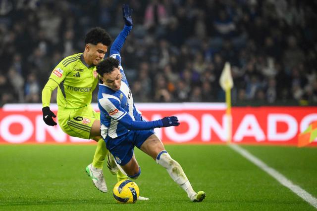 AVS' Brazilian midfielder #06 Gustavo Assuncao and FC Porto's Brazilian forward #11 Pepe fight for the ball during the Portuguese League football match between FC Porto and AVS at Dragao stadium in Porto on December 29, 2025. (Photo by Miguel RIOPA / AFP)