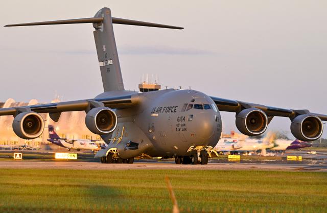 A Boeing C-17 Globemaster taxis on a tarmac at Rafael Hernandez Airport in Aguadilla, Puerto Rico, on December 29, 2025. The United States has deployed a major military force in the Caribbean and has recently intercepted oil tankers as part of a naval blockade against Venezuelan vessels it considers to be under sanctions. Since September, US forces have launched dozens of air strikes on boats that Washington alleges, without showing evidence, were transporting drugs. More than 100 people have been killed. (Photo by Miguel J. Rodriguez Carrillo / AFP)