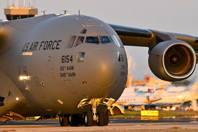 A Boeing C-17 Globemaster taxis on a tarmac at Rafael Hernandez Airport in Aguadilla, Puerto Rico, on December 29, 2025. The United States has deployed a major military force in the Caribbean and has recently intercepted oil tankers as part of a naval blockade against Venezuelan vessels it considers to be under sanctions. Since September, US forces have launched dozens of air strikes on boats that Washington alleges, without showing evidence, were transporting drugs. More than 100 people have been killed. (Photo by Miguel J. Rodriguez Carrillo / AFP)