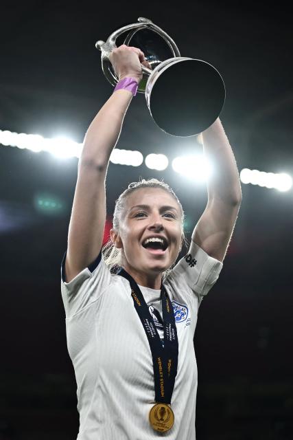 (FILES) England's midfielder Leah Williamson celebrates with the trophy after England's victory in the "Finalissima" International football match between England and Brazil at Wembley Stadium in London on April 6, 2023. England football captain Leah Williamson was made a Commander of the Order of the British Empire (CBE) in the 2026 New Years Honours List. (Photo by Ben Stansall / AFP)
