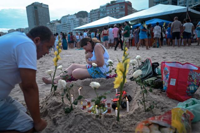 Worshippers pay tribute to Iemanja, the sea goddess of the Afro-Brazilian Umbanda religion, at Copacabana Beach in Rio de Janeiro, Brazil, on December 29, 2025. (Photo by MAURO PIMENTEL / AFP)