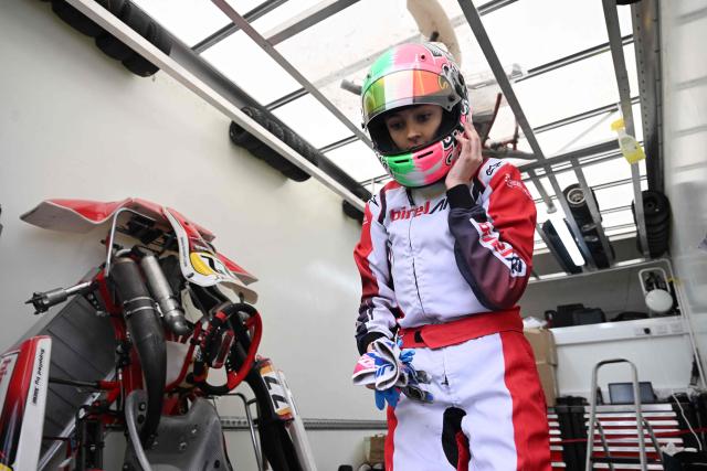 This photo taken on November 15, 2025 shows 15-year-old Skye Parker during a day out at the Shenington Kart Racing Club track in Shenington, central England. A dozen girls whizzed around an English karting track, part of a pioneering drive to draw women into motorsports and maybe even race to the top in male-dominated Formula 1. (Photo by Paul ELLIS / AFP)