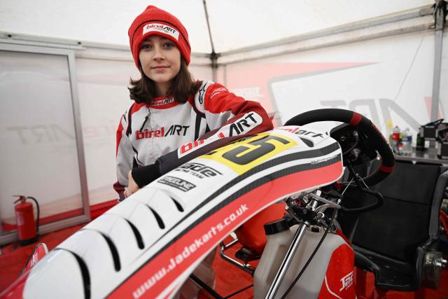 This photo taken on November 15, 2025 shows 15-year-old Skye Parker posing during a day out at the Shenington Kart Racing Club track in Shenington, central England. A dozen girls whizzed around an English karting track, part of a pioneering drive to draw women into motorsports and maybe even race to the top in male-dominated Formula 1. (Photo by Paul ELLIS / AFP)