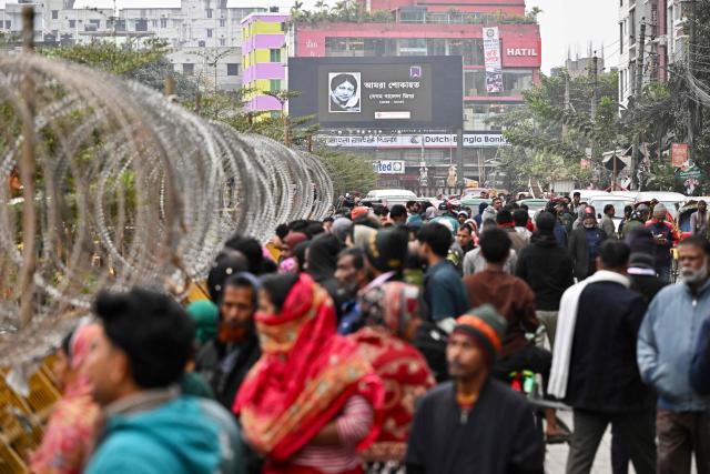A billboard featuring Bangladesh's late former prime minister Khaleda Zia is displayed outside the barricaded Evercare hospital in Dhaka on December 30, 2025. Zia, who many believed would sweep elections next year to lead her country once again, died on December 30 aged 80, her Bangladesh Nationalist Party (BNP) said. (Photo by MUNIR UZ ZAMAN / AFP)