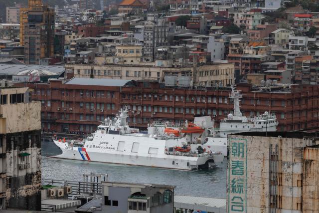 Taiwanese Coast Guard Administration (CGA) vessel Su'ao (CG612) sails at the Keelung Harbour in Keelung on December 30, 2025, amid Chinese military drills around Taiwan. China launched missiles and deployed dozens of fighter aircraft and navy vessels around Taiwan on December 30 for a second day of live-fire drills aimed at simulating a blockade of the self-ruled island's key ports and assaults on maritime targets. (Photo by CHENG Yu-chen / AFP)