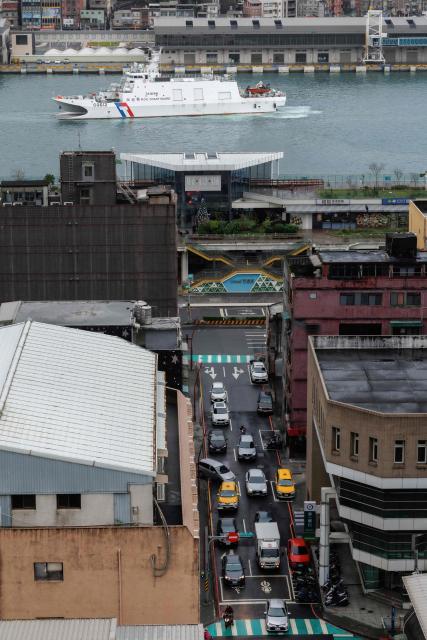 Taiwanese Coast Guard Administration (CGA) vessel Su'ao (CG612) sails at the Keelung Harbour in Keelung on December 30, 2025, amid Chinese military drills around Taiwan. China launched missiles and deployed dozens of fighter aircraft and navy vessels around Taiwan on December 30 for a second day of live-fire drills aimed at simulating a blockade of the self-ruled island's key ports and assaults on maritime targets. (Photo by CHENG Yu-chen / AFP)