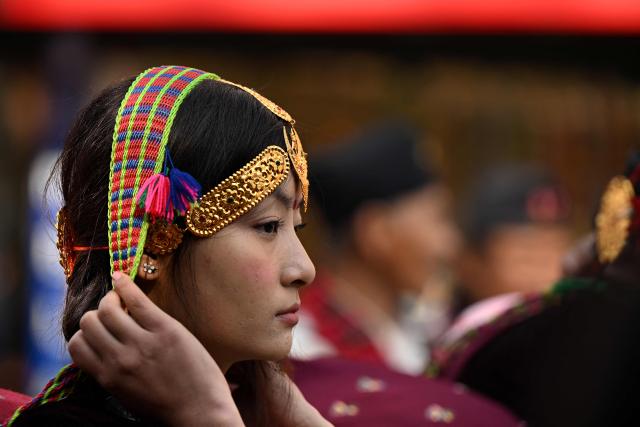 A Gurung indigenous community member takes part in Tamu Lhosar festival celebrations marking the commencement of Gurung New Year in Kathmandu on December 30, 2025. (Photo by PRAKASH MATHEMA / AFP)