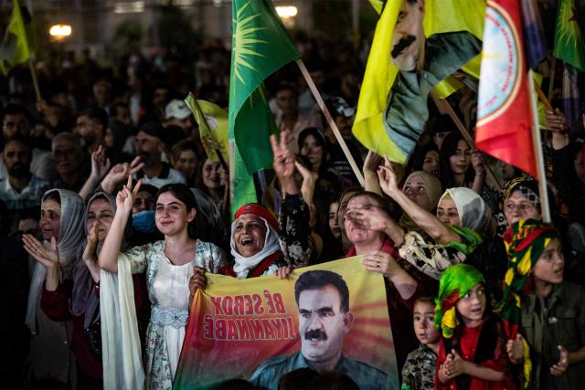 (FILES) Supporters attend a rally airing a televised statement by the jailed leader and founder of Turkey's Kurdistan Workers' Party (PKK) Abdullah Ocalan in Syria's predominantly-Kurdish northeastern city of Qamishli on July 9, 2025. Jailed Turkish Kurd leader Abdullah Ocalan said in a message published on December 30, 2025 that it was "crucial" for the Turkish government to broker a peace deal between the Kurdish-led Syrian Democratic Forces (SDF) and the Damascus government. (Photo by Delil SOULEIMAN / AFP)