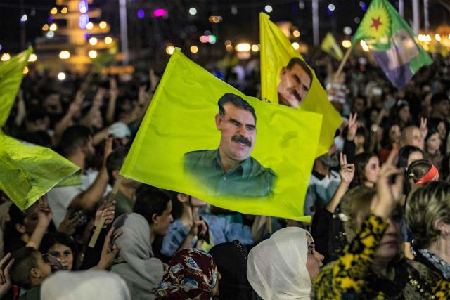 (FILES) Supporters attend a rally airing a televised statement by the jailed leader and founder of Turkey's Kurdistan Workers' Party (PKK) Abdullah Ocalan in Syria's predominantly-Kurdish northeastern city of Qamishli on July 9, 2025. Jailed Turkish Kurd leader Abdullah Ocalan said in a message published on December 30, 2025 that it was "crucial" for the Turkish government to broker a peace deal between the Kurdish-led Syrian Democratic Forces (SDF) and the Damascus government. (Photo by Delil SOULEIMAN / AFP)