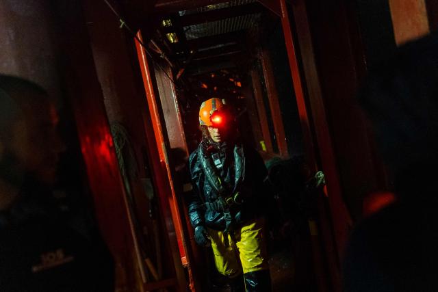 A crew member of the “Ocean Viking” rescue ship, operated by the French NGO SOS Mediterranee, takes part in a team night exercise to prepare for a rescue situation at sea with a "RHIB", an inflatable dinghy, on their way to the search-and-rescue zone in international waters in the Mediterranean Sea, on December 29, 2025. Migrants rescue ship "Ocean Viking" is preparing to return to operations following the attack it suffered on August 24, 2025 when Libyan Coast Guard forces fired directly on the rescue vessel operated by the NGO SOS Mediterranee. (Photo by Sameer Al-DOUMY / AFP)